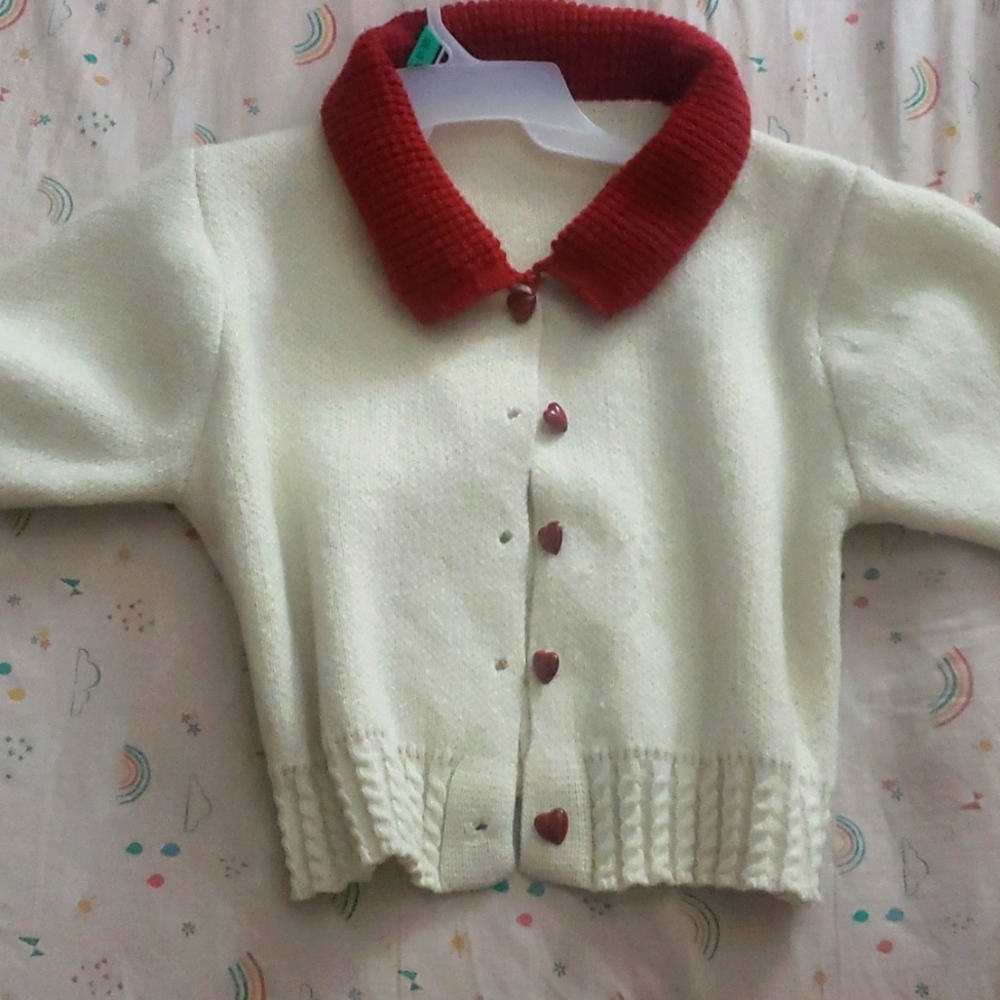 I'm selling a valentines day cardigan it's white and red the colors of love ❤
